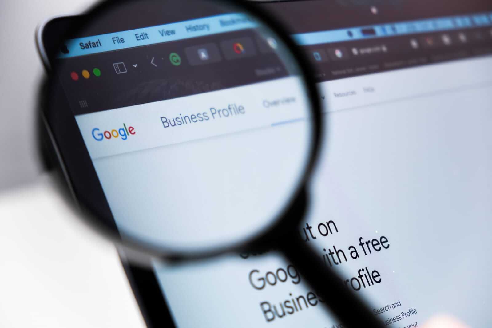 google-business-profile-logo-enlarged-through-a-magnifying-glass-on-a-laptop-screen